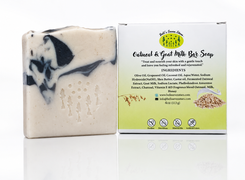 Oatmeal and goat milk bar soap with packaging on a white background